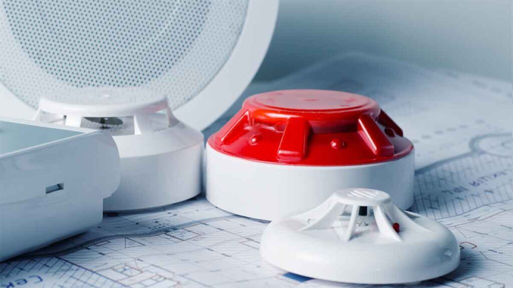 Close-up of fire alarm system components, illustrating modern fire alarm design for commercial safety. 