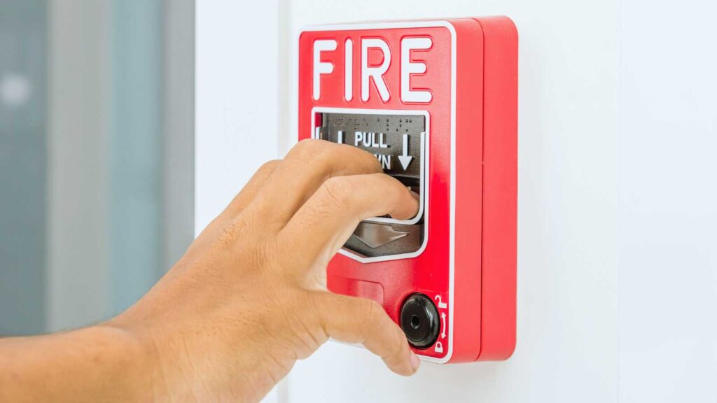 Fire Safety Risks for Commercial Buildings – Fire alarm pull station for rapid emergency response. 