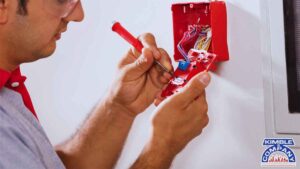 Certified specialist inspecting and maintaining fire alarm equipment as part of fire inspection services to keep your tenants and employees safe