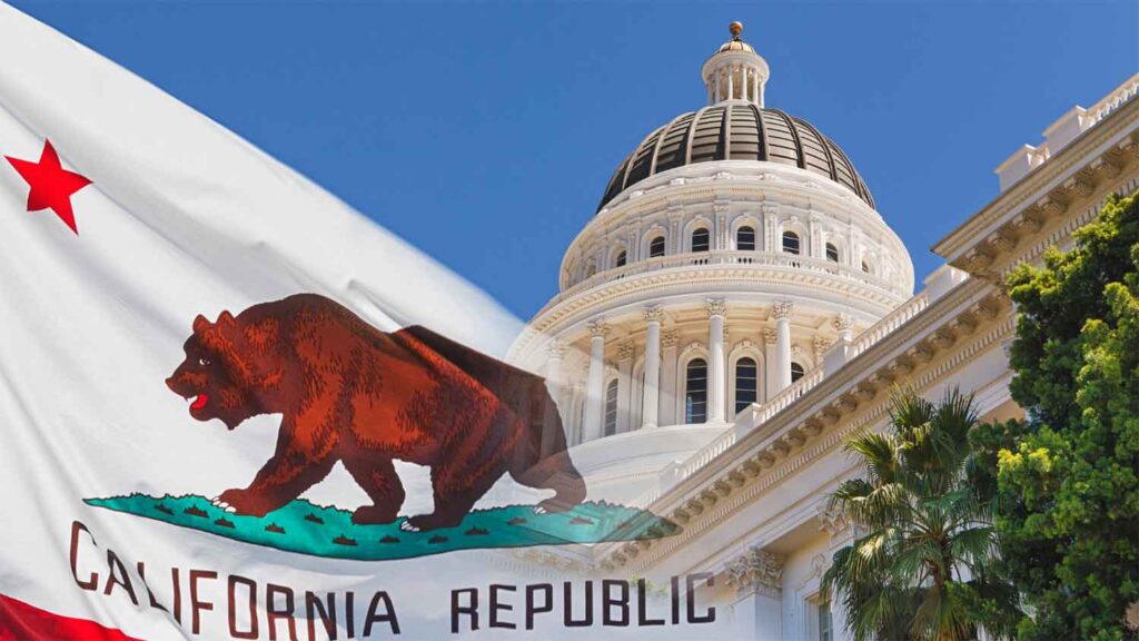  California state flag waves near the Capitol building.