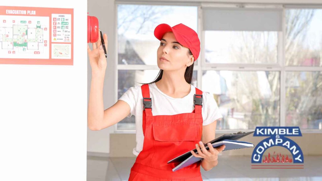 Technician inspects a fire alarm system